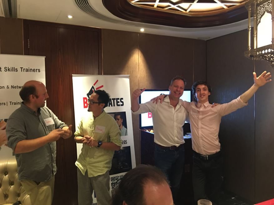 Participants taking part in an energetic presentation exercise